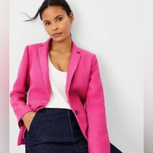 Poppy pink blazer. Never worn; sewn pockets and slit. Small pill imperfection.